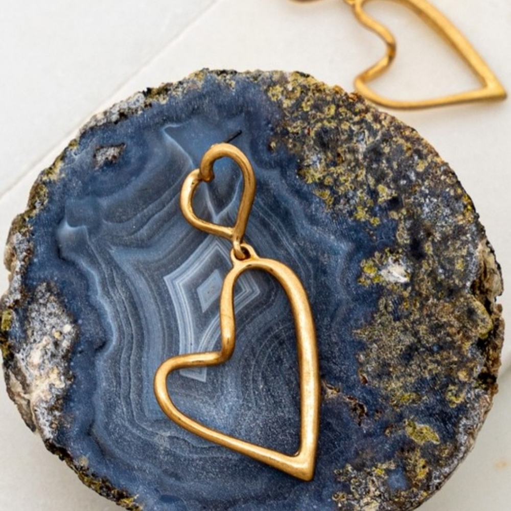 Gold double linked heart hoop earrings.